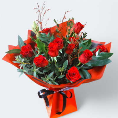 12 Red Rose Bouquet - 12 long stemmed luxury Red Roses designed in a hand-tied bouquet with a mix of fresh seasonal foliages. Aqua-packed in water for extra freshness and presented in a presentation bag or box for delivery.
